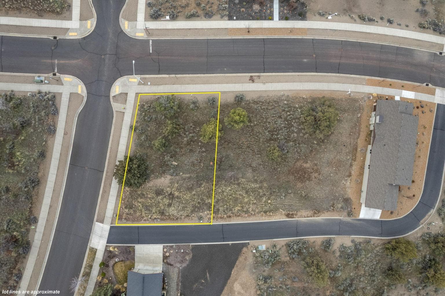 Showing the paved street access along SE Greenleaf Lane.