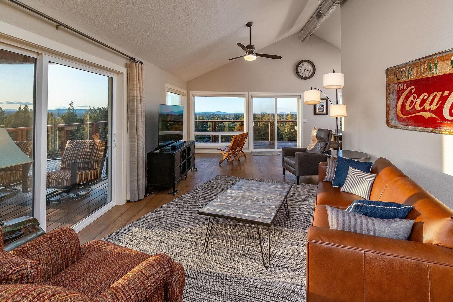 Vaulted ceilings and oversized windows showcase breathtaking mountain vistas.