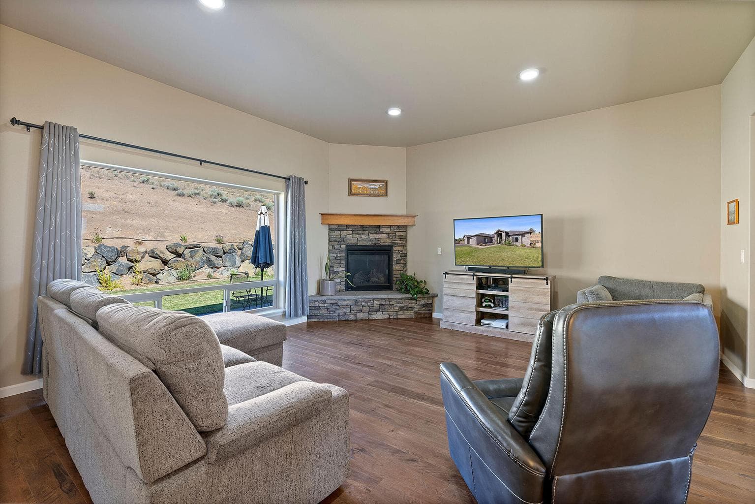 Large windows with abundant natural light and a propane fire place.