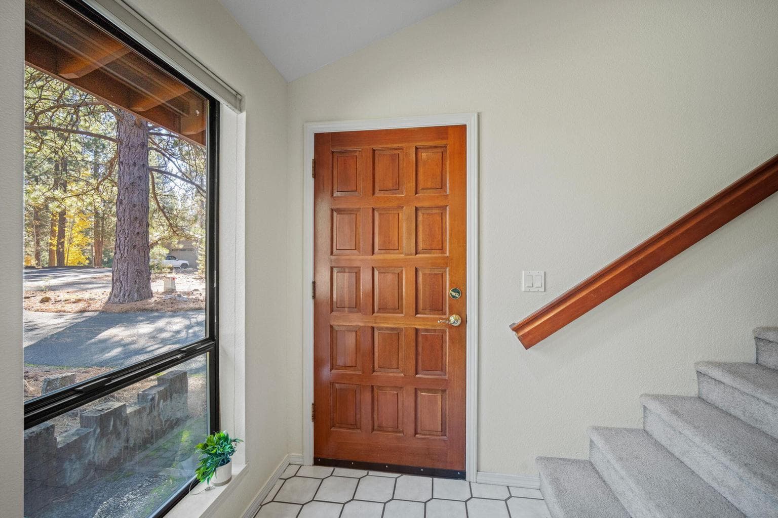 Main Entry opens to tile flooring and a bright and welcoming foyer.