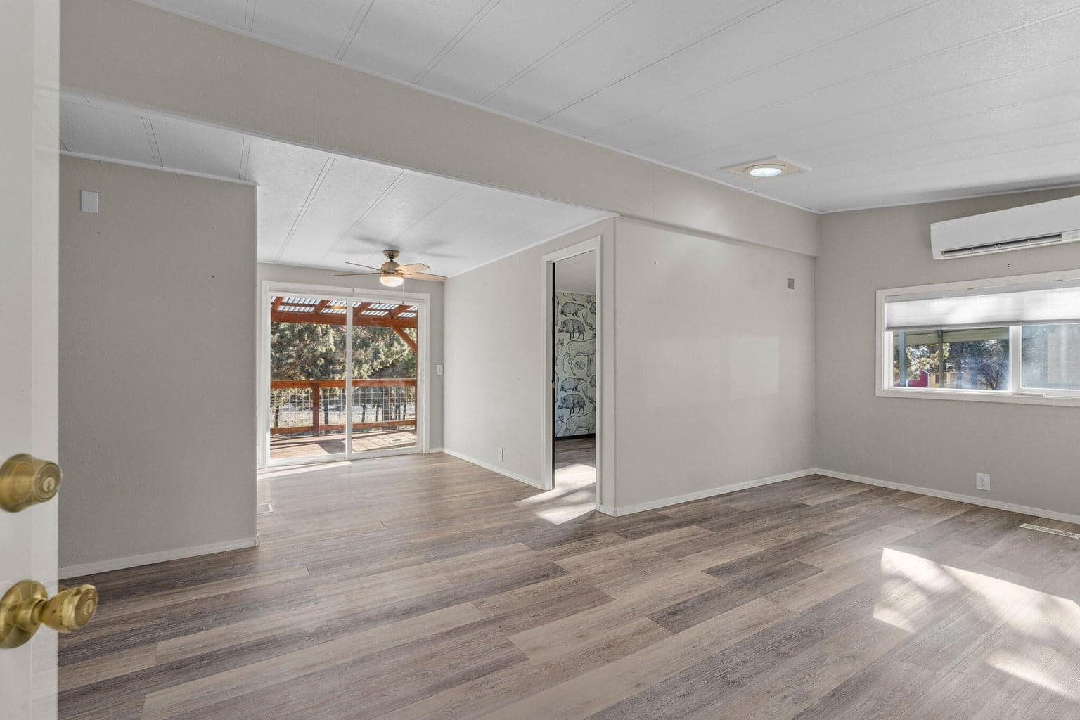 Bright and open living area upon entry into the main living spaces.