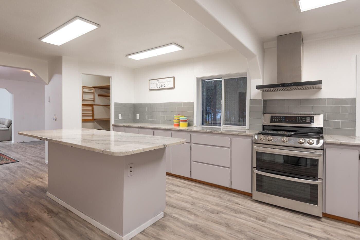 Kitchen with solid surface counters and plenty of storage, plus pantry