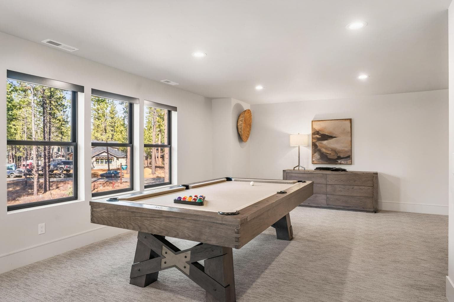A bonus room with a pool table, and a spacious living area ideal setting for family.