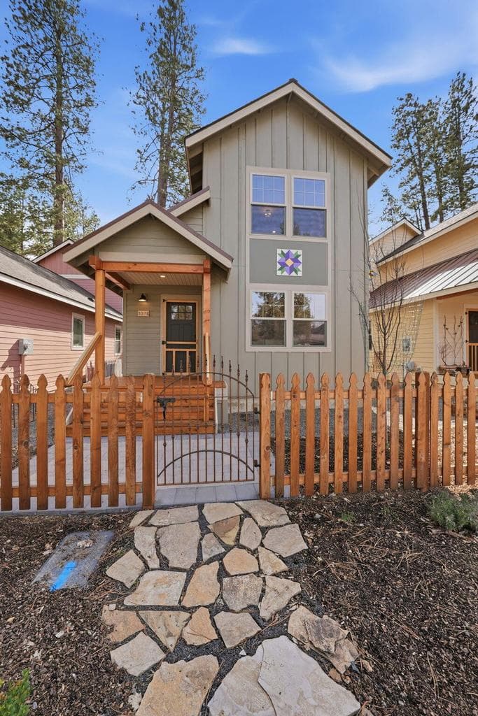 Paver front walkway leads to easy to maintain landscaped low maintenance front yard.