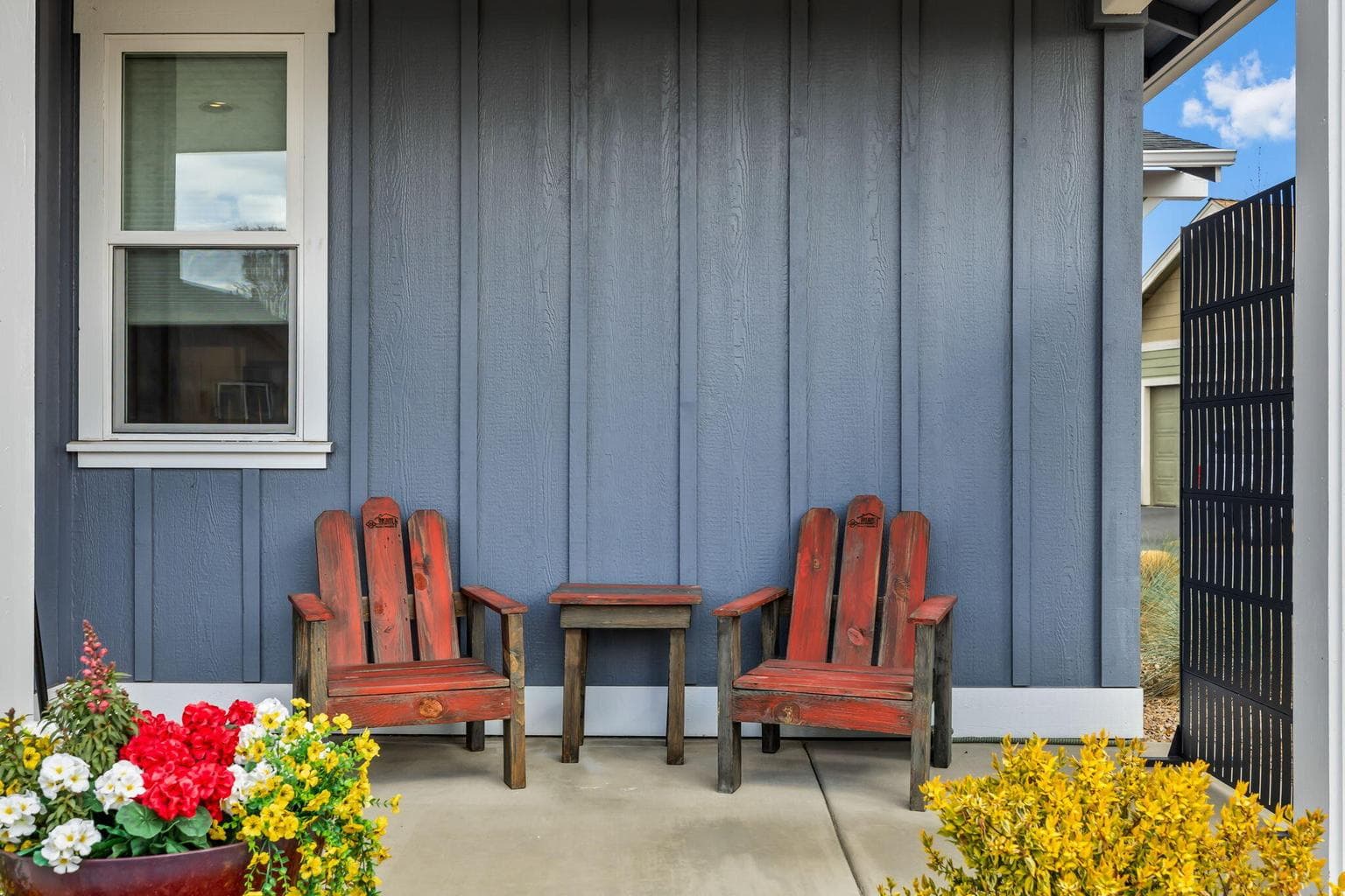 The covered side porch, perfect for year-round outdoor entertaining.