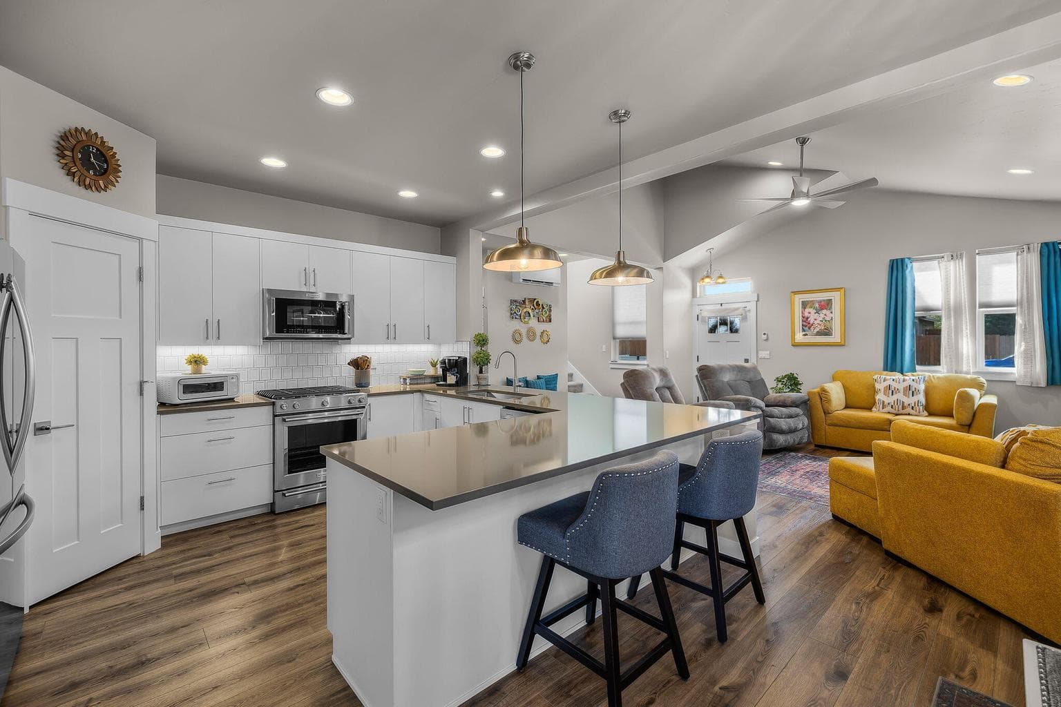 Kitchen overview featuring ample cabinetry, counter space, and a breakfast bar.