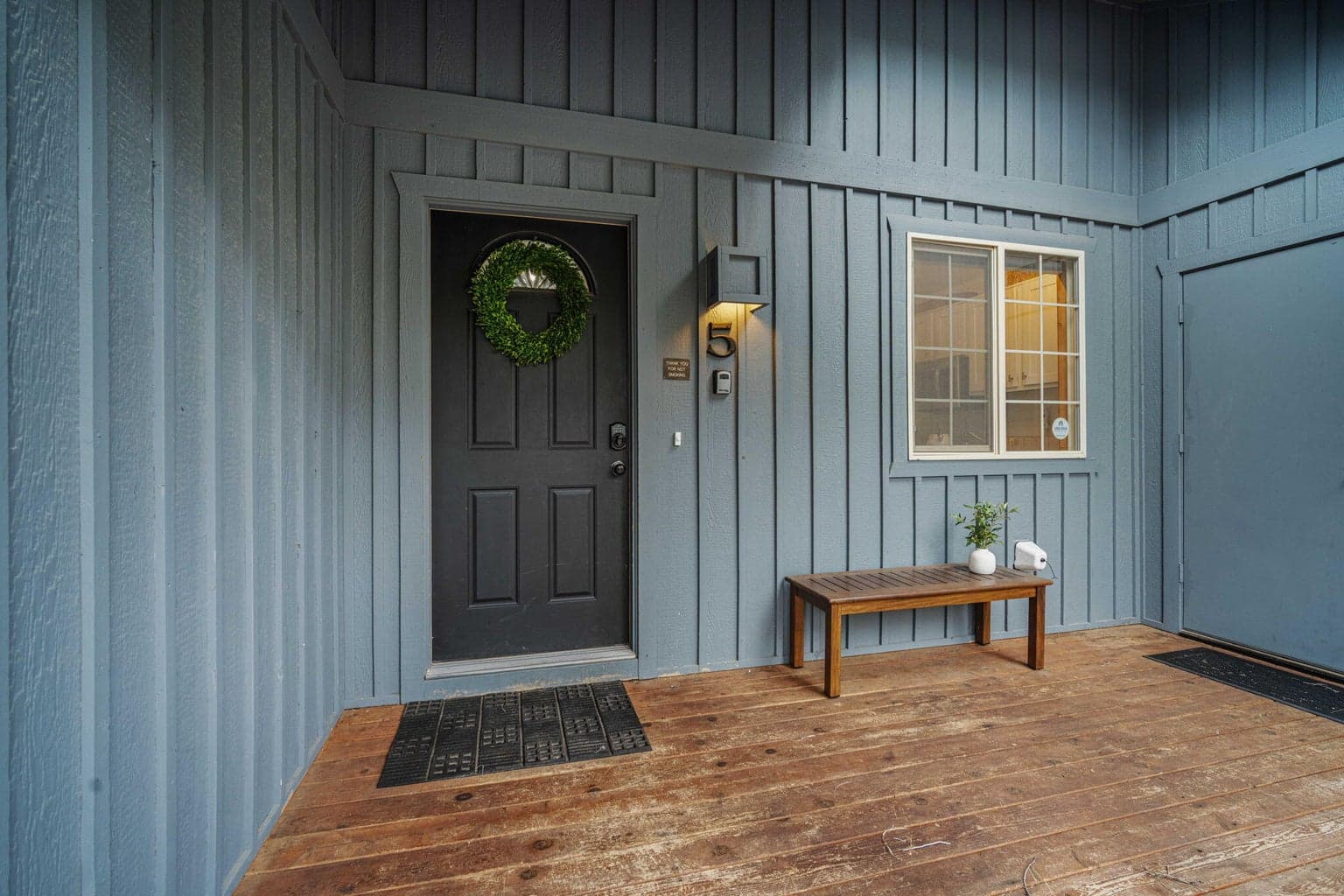 Front porch at 5 Camas also serves as a covered passthrough area to access the garage
