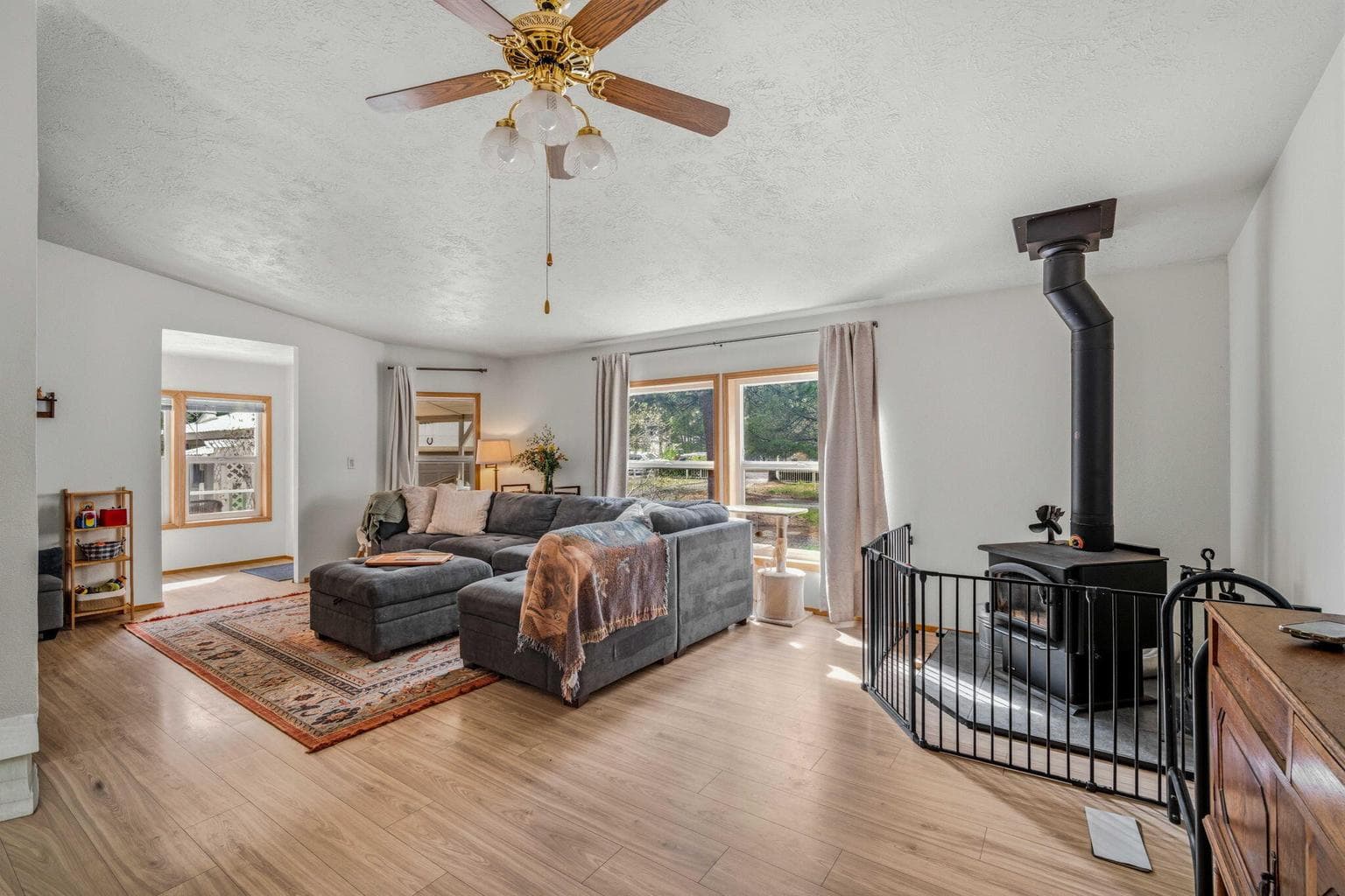 Spacious living room with a wood burning stove