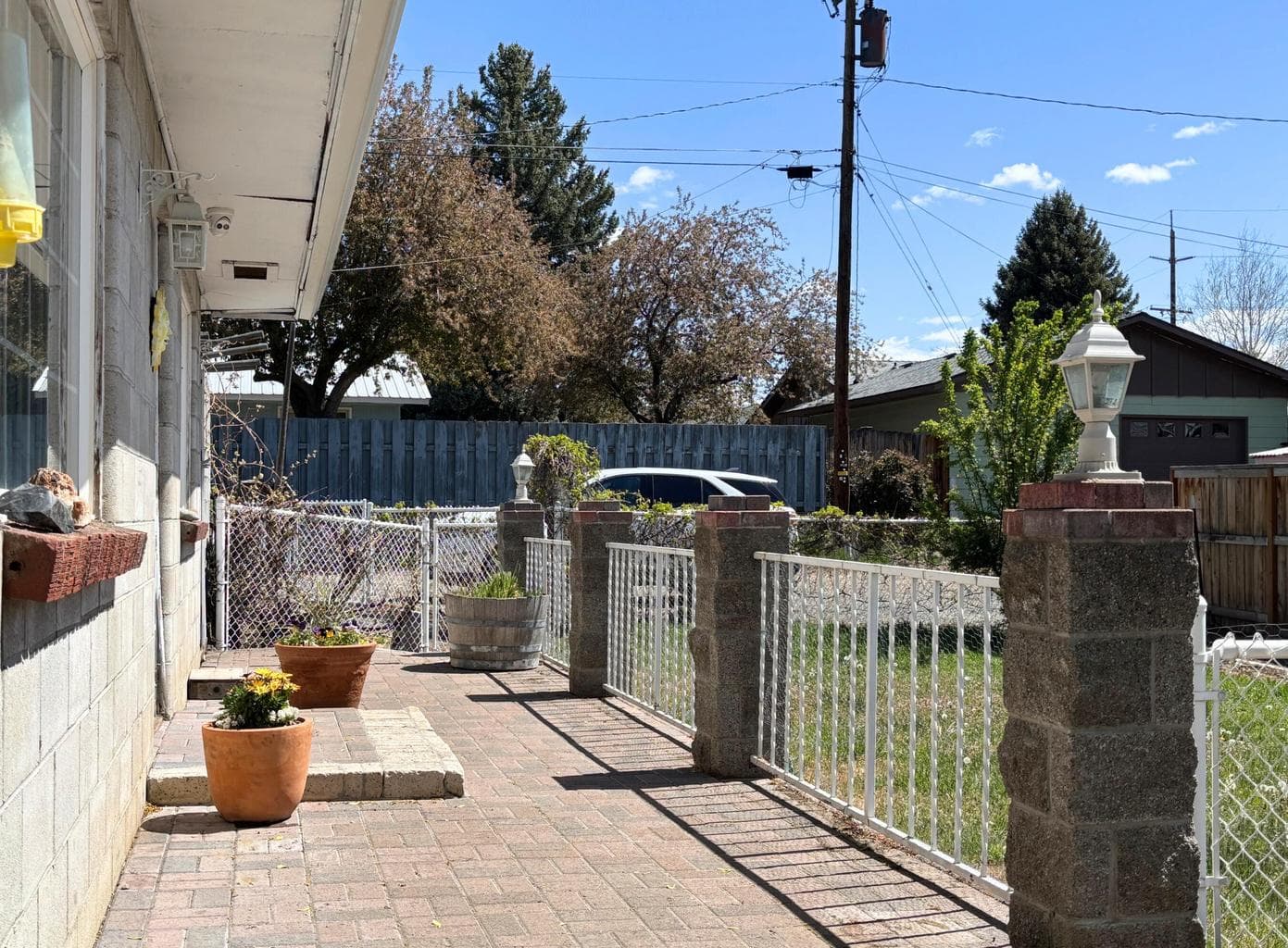 Front porch area and the fenced yard.
