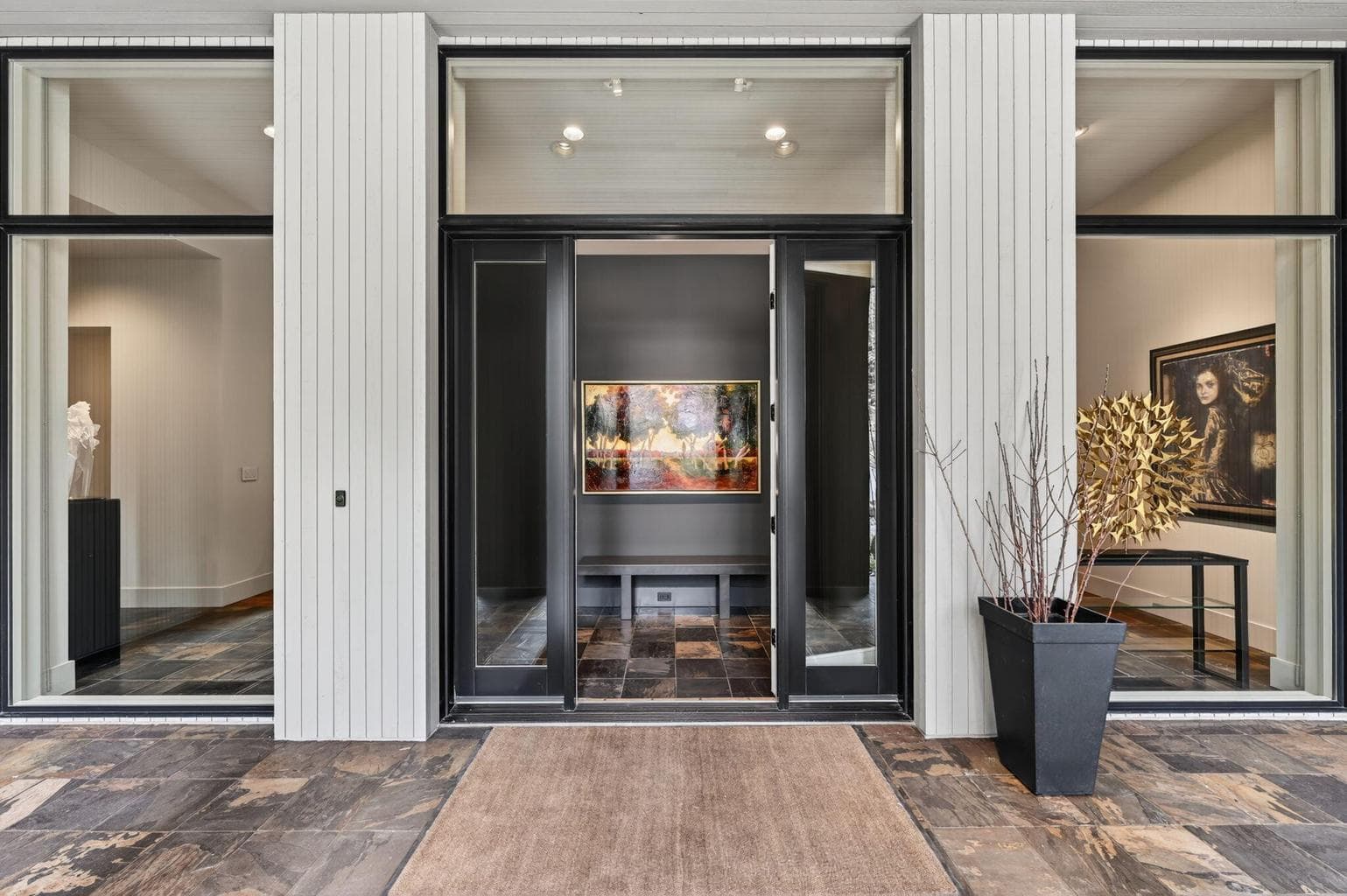 Front entry way - featuring a wall of floor-to-ceiling windows