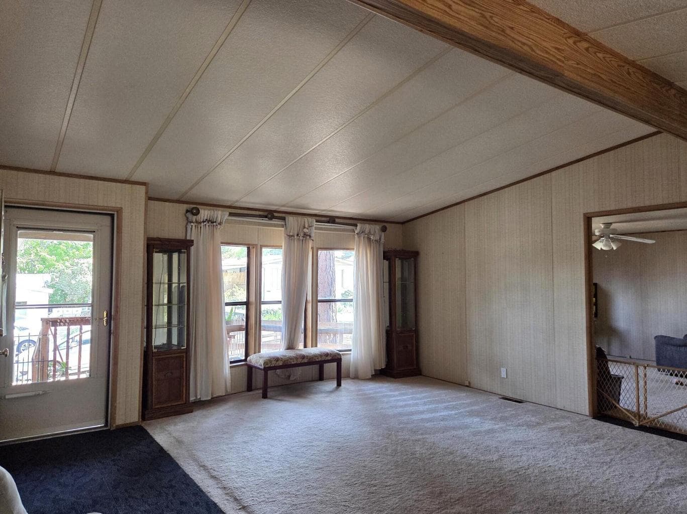 living room is light and bright and has a bay window.