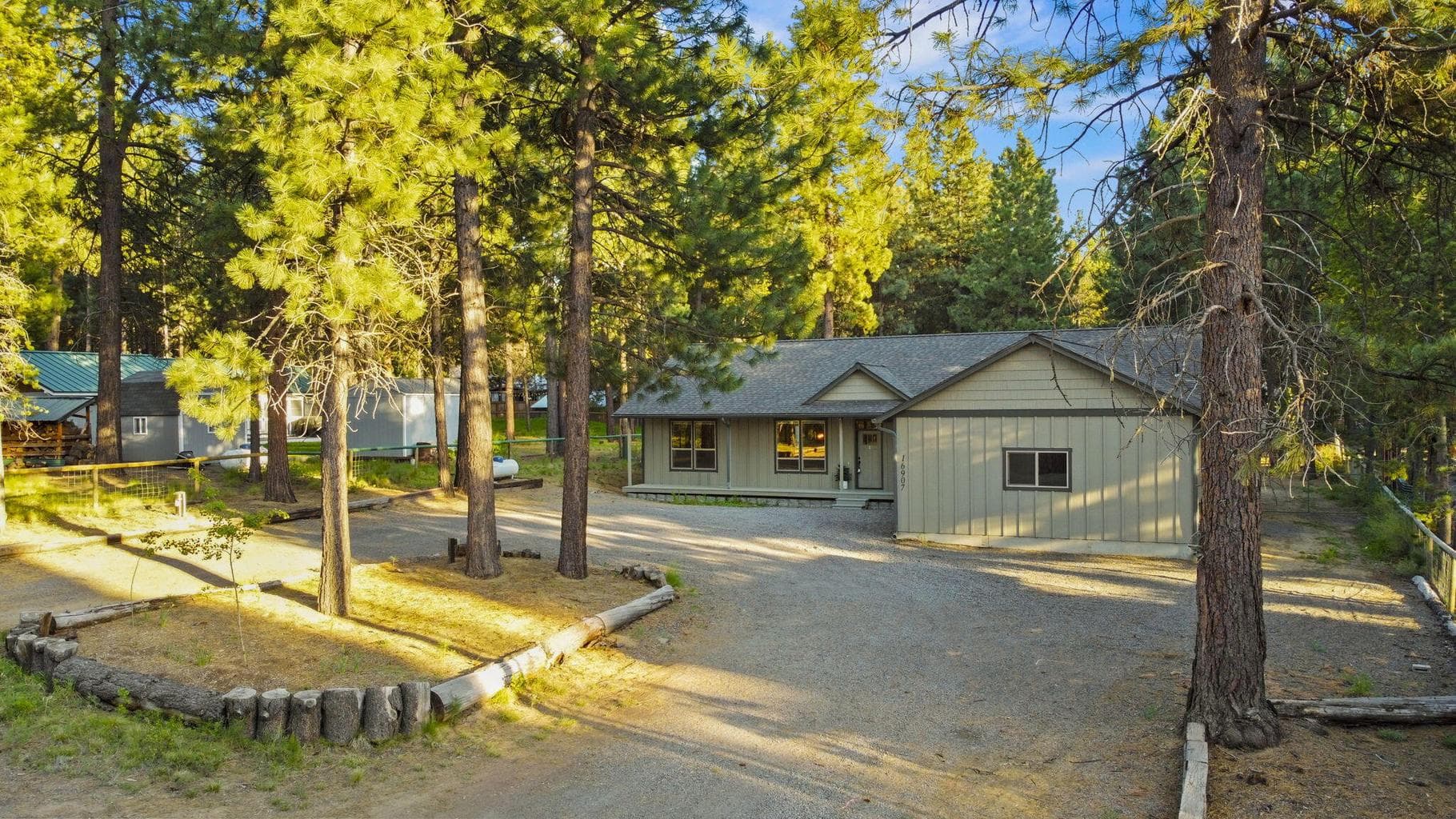 .51-acre lot with mature trees and spacious gravel driveway.