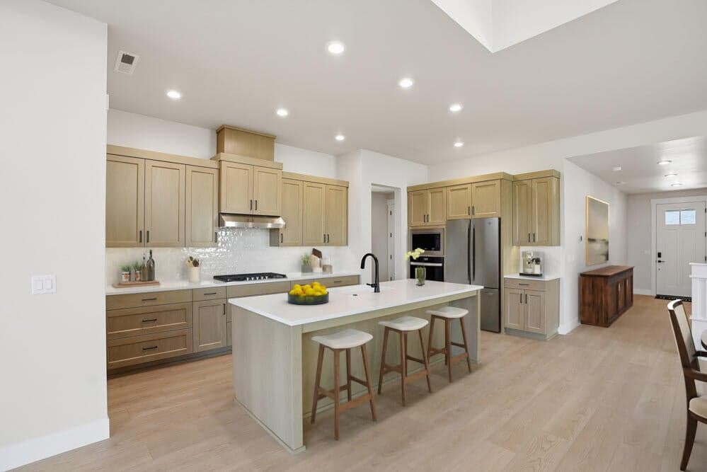 Subject property - virtual staging. Kitchen with upgraded appliance package including refrigerator.