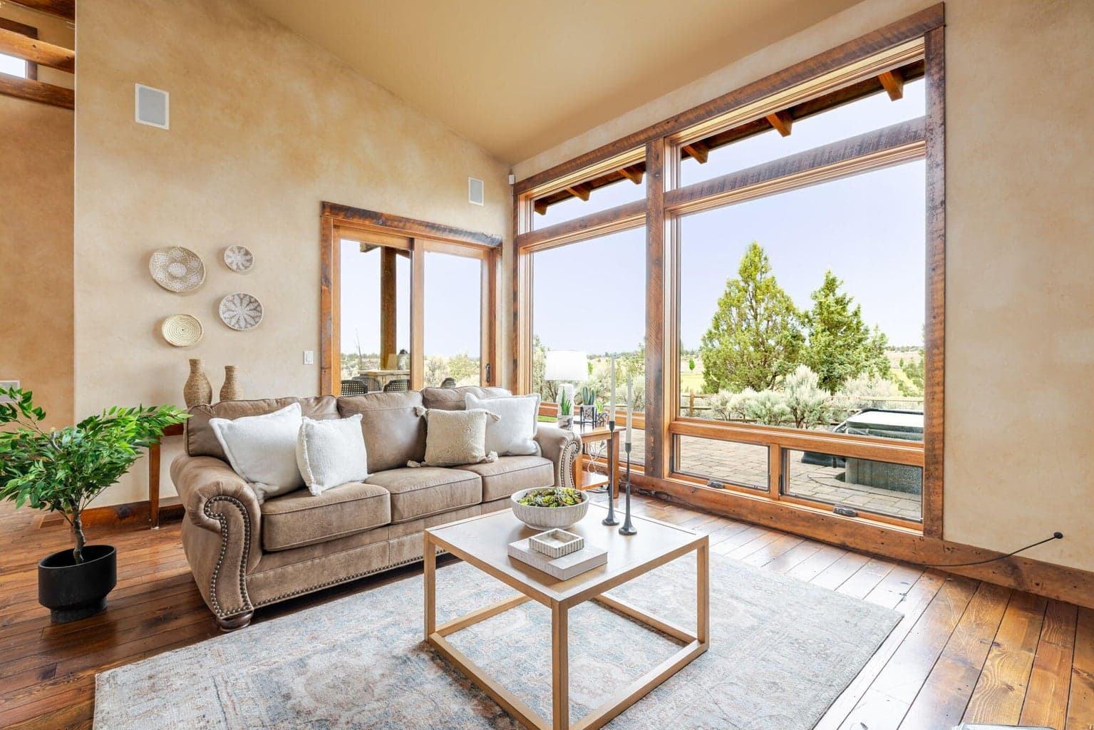 Living room with views of the ranch and fenced back yard.