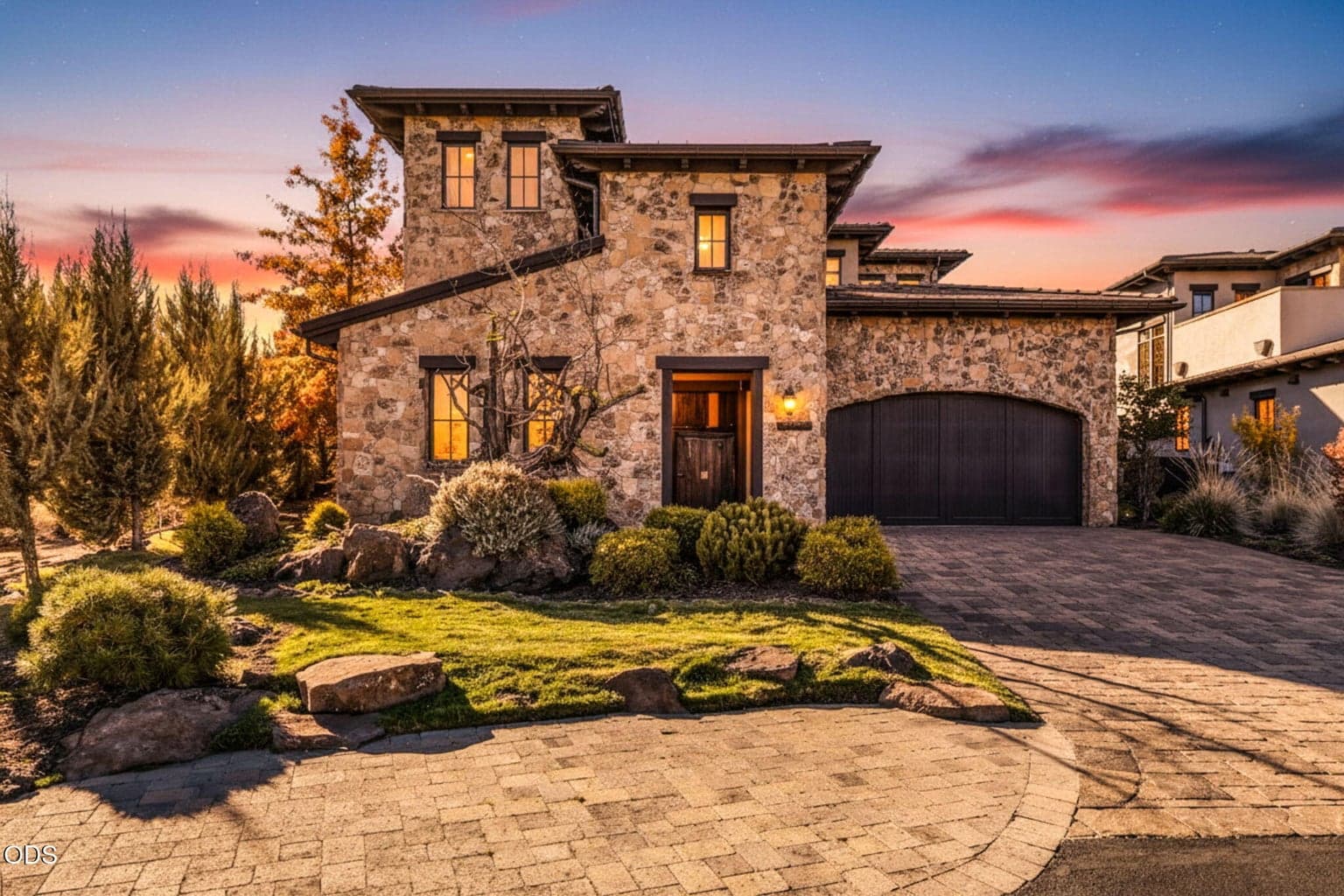 The home's all-stone exterior creates a striking and commanding presence