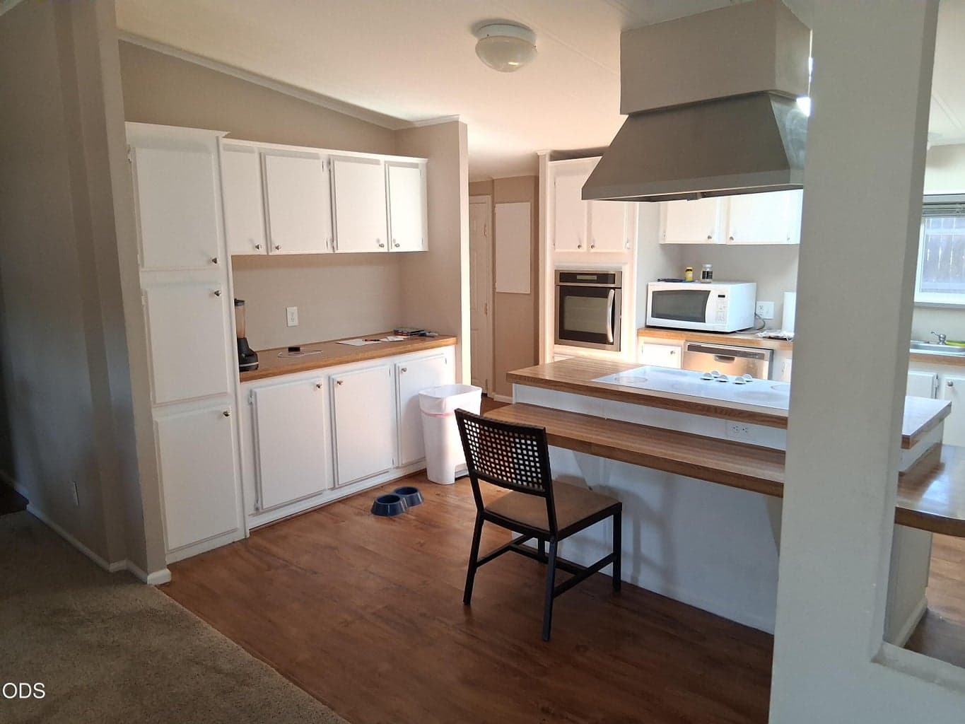 Lots of cabinets and breakfast bar