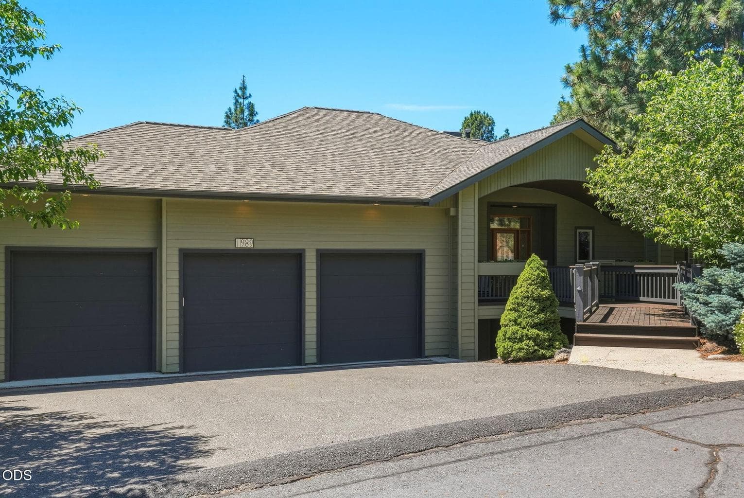 Spacious 3-car garage (~852 SF) with soaring ceilings offers ample room for vehicles, storage, recreational gear, and all your Central Oregon toys, complemented by a level driveway for easy access, hard to come by in West Hills