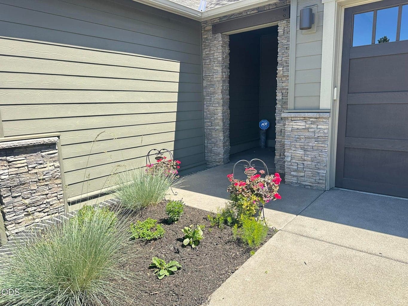 Covered exterior entry area is inviting.