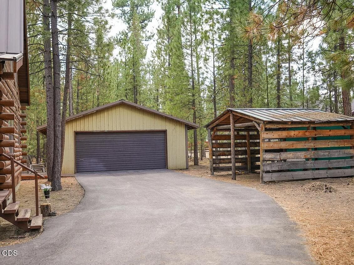 Detached garage & wood storage