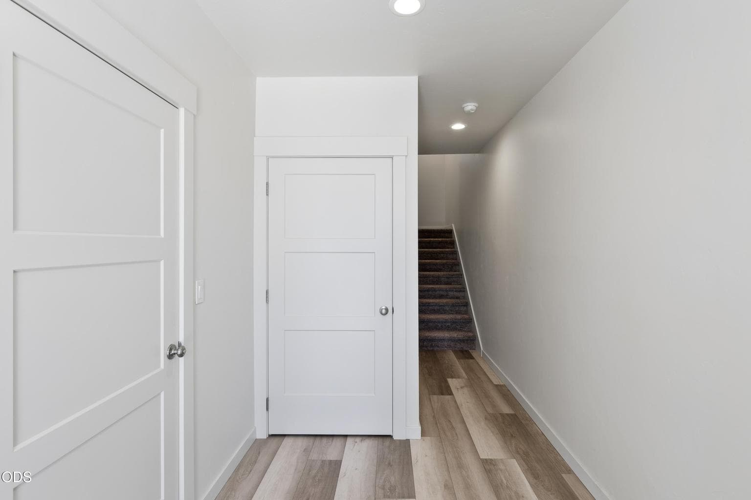 lower level feature s garage space, coat closet and stairs up to main level