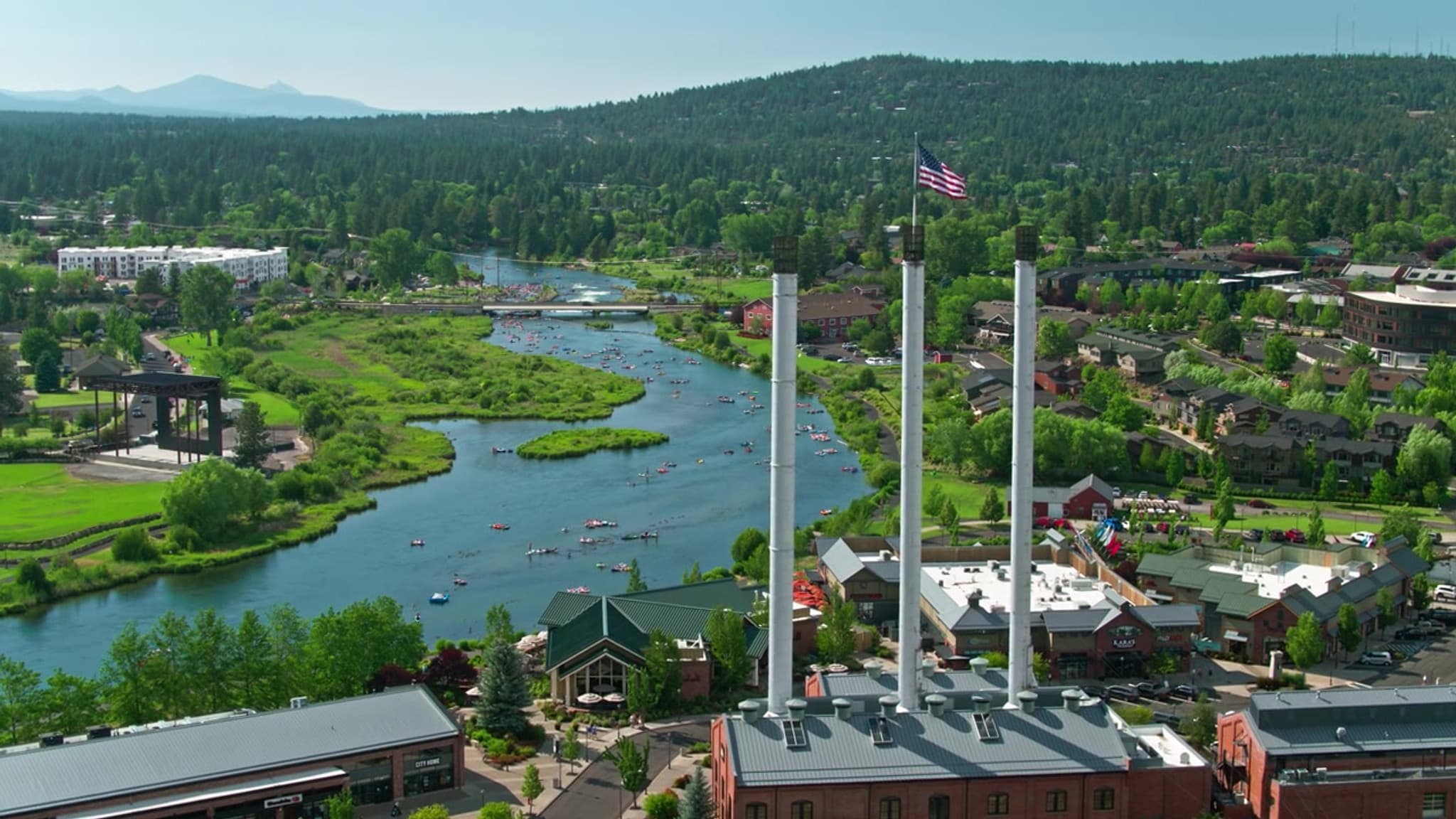 Aerial view of the Old Mill District smokestacks and the Deschutes River in Bend, Oregon